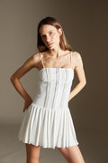 White dress with pleated skirt